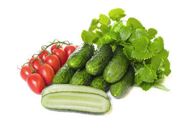 vegetables cucumbers and tomatoes on a white background