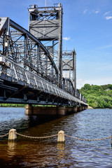Steel Bridge over water in urban setting