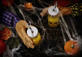 Obraz na płótnie Canvas Orange cocktail for Halloween party