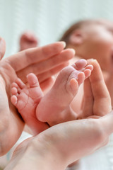 Baby feet in mother hands