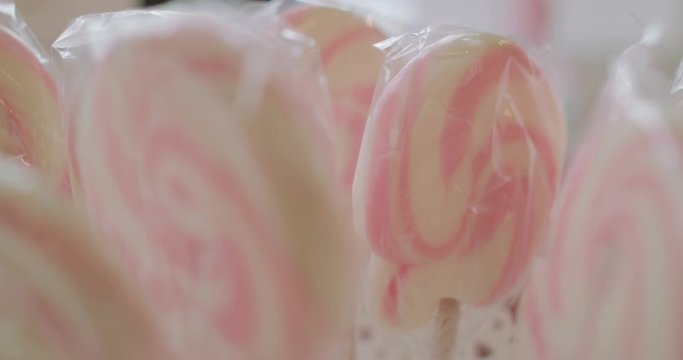 Sweet Lolipops on wedding table.