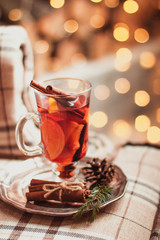 Beautiful Christmas mulled wine in a glass in decorating  New Year interior background