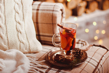 Beautiful Christmas mulled wine in a glass in decorating  New Year interior background