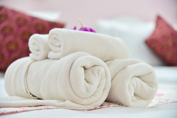 Fototapeta na wymiar White towels on bed in the bedroom.