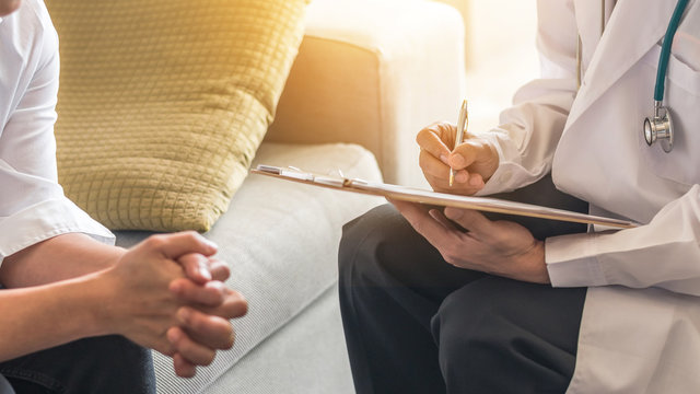 Woman patient having consultation with doctor (gynecologist or psychiatrist) and examining  health in medical gynecological clinic or hospital mental health service center