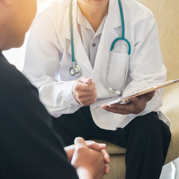 Male Patient Having Consultation With Doctor Or Psychiatrist Who Working On Diagnostic Examination On Men's Health Disease Or Mental Illness In Medical Clinic Or Hospital Mental Health Service Center