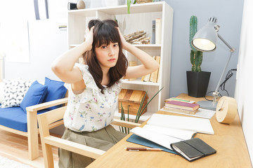 Young woman reading a book at room