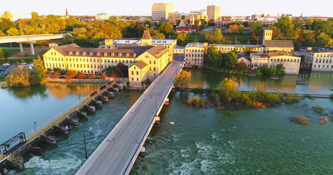 Sunrise flyover of beautiful Appleton Wisconsin riverfront and downtown in Autumn.

