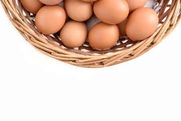 eggs in basket filled isolated on white background.