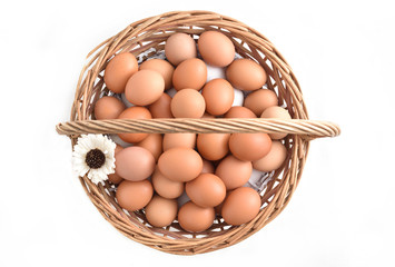 eggs in basket filled isolated on white background.
