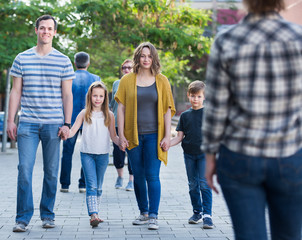 Friendly family going in the park together