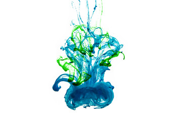 Colorful ink dropping in the water isolated in white background