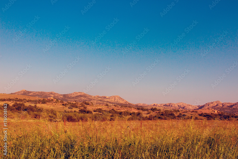 Wall mural Warm evening light in Wichita Mountains Wildlife Refuge in Oklahoma