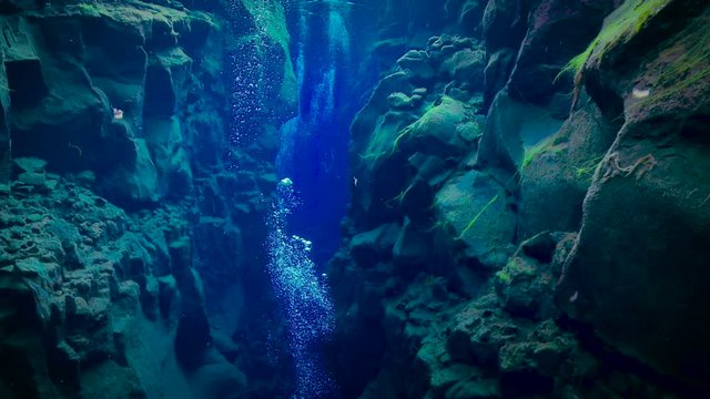 Bubbles Rising Up Through Deep Blue Underwater Trench