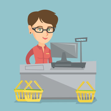 Young caucasian cashier standing at the checkout with a cash register in the supermarket. Smiling cashier working at the checkout in the supermarket. Vector cartoon illustration. Square layout.