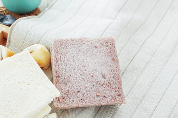Bread on tablecloth.