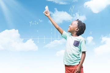 Fototapeta na wymiar Composite image of child holding paper airplane