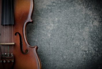 Fototapeta na wymiar vintage violin on concrete background