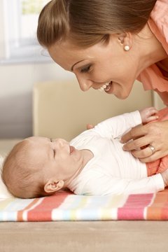 Mother and baby laughing