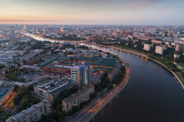 The big city and the river at sunset in the summer