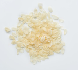 Rice flakes isolated on white background. Top view.