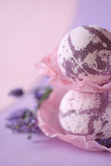 Lavender bath bombs. bomb for a bath with lavender extract on a gentle lilac background and lavender flowers.  natural cosmetics concept 