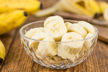 Portion of Sliced Bananas on wooden background, selective focus
