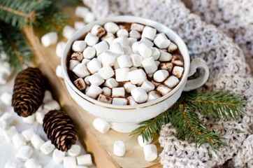 Hot chocolate with marshmallow on the table with Christmas decorations