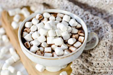 Hot chocolate with marshmallow on the table with Christmas decorations
