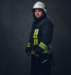 Fototapeta premium Studio portrait of firefighter dressed in uniform.