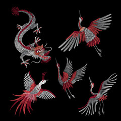 Set. a crane, a fire bird, a dragon and red roses. Traditional folk stylish stylish embroidery on the black background. Sketch for printing on clothing, fabric, bag, accessories and design. 