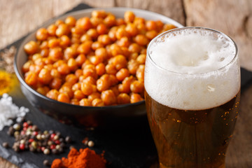 Cold beer and fried spicy chickpeas close-up. horizontal