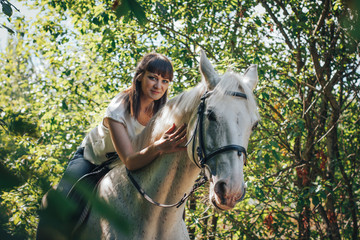 Fototapeta premium Girl and horse in the woods