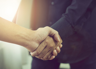 Joint Hands of Two Businessmen After Negotiating a Successful Business Agreement, And the handshake together. This is to promote cooperation in the joint business. Teamwork planning