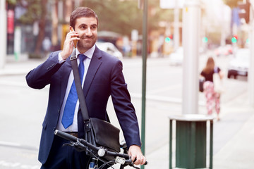 Young businessmen with a bike