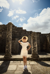 Girl in a dress on ruins. Capitol. Travel, vacation. Tunisia, Dougga.