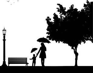 Mother walking under the umbrellas with her child in park, one in the series of similar images silhouette