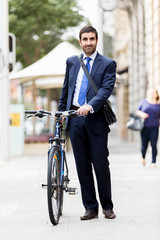 Young businessmen with a bike