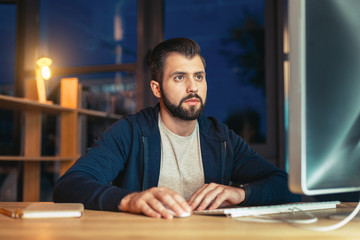 Fototapeta premium Delighted male person working at his project