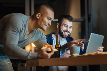 Profile photo of smiling man that holding pizza