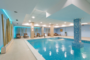Indoor swimming pool in hotel spa center - obrazy, fototapety, plakaty