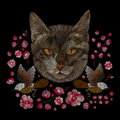 portrait of a cat and flowers. traditional stylish fashionable embroidered embroidery on a black background. sketch for printing on fabric, bag, clothes, accessories and design. trend vector