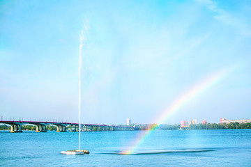 Beautiful View of the river Dnieper with high fountain and rainbow . Dnipro city, Ukraine