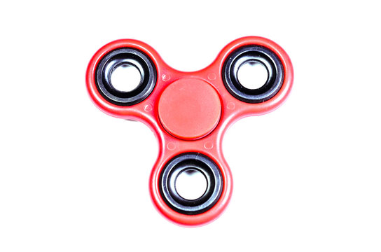 Red fidget spinner isolated on white