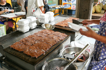 Local seller make Thai sweetmeat coconut macaroon, Ba Bin at Sriyan market, Bangkok, Thailand