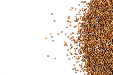 Scattering of buckwheat on white background