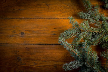 Christmas fir tree with decoration on wooden board