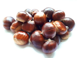 Heap of fresh chestnuts on white background
