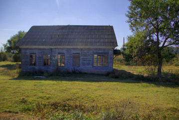 Obraz premium An old abandoned wooden house with walls made of straw. Astrakhan region. Russia. HDR Photo with post processing effects. 