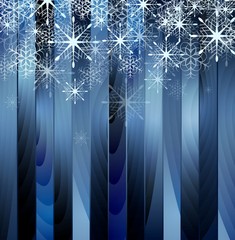 Falling snowflakes on blue wooden background